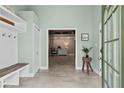 Bright foyer with a coat rack and an inviting entryway to the home at 5906 Rosie Se Ln, Mableton, GA 30126