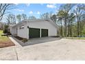 Spacious garage with a double-car garage door and ample parking space at 5906 Rosie Se Ln, Mableton, GA 30126