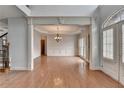 Elegant dining room with hardwood floors, chandelier, and decorative molding at 2723 Ivy Bluff Ct, Buford, GA 30519