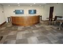 Inviting common area with bar, stylish patterned carpet, tables and TVs, ideal for residents to relax at 3324 Peachtree Ne Rd # 1010, Atlanta, GA 30326