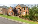 Eye-catching brick home with mature landscaping and shutters exudes traditional charm at 4020 Balleycastle Ln, Duluth, GA 30097
