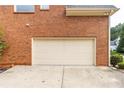 This property features a spacious two-car garage with an expansive driveway at 4020 Balleycastle Ln, Duluth, GA 30097