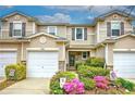 Lovely townhomes with well-manicured lawns, appealing exteriors, and convenient one car garages at 338 Oak Leaf Pl, Acworth, GA 30102