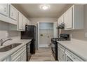 Well-equipped kitchen featuring stainless steel appliances, ample counter space, and pantry at 104 Natchez Trce, Atlanta, GA 30350
