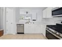 Well-lit kitchen featuring stainless steel appliances and a functional layout at 10900 Wittenridge Dr # D5, Alpharetta, GA 30022