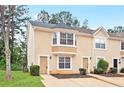 Charming two-story home featuring a well-maintained lawn and inviting curb appeal with beautiful front windows at 3116 Fields Dr, Lithonia, GA 30038