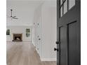 Inviting foyer with wood-look flooring and views of the living room and fireplace at 111 Shenandoah Ct, Hiram, GA 30141