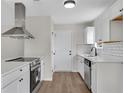 Modern kitchen with stainless steel appliances, white cabinetry and countertops at 111 Shenandoah Ct, Hiram, GA 30141
