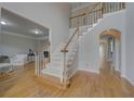 Open foyer with hardwood floors and staircase leading to the second floor at 1658 Lightfoot Cir, Marietta, GA 30062
