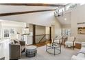 Spacious living area with vaulted ceilings, hardwood floors, and an open floor plan at 645 Trailmore Pl, Roswell, GA 30076
