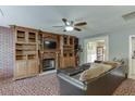 Cozy living room with built-in bookshelves, fireplace, and comfortable seating arrangement at 1480 Bramlett Forest Se Trl, Lawrenceville, GA 30045