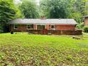 Spacious backyard featuring a brick patio area, perfect for outdoor entertaining at 3727 Dial Dr, Stone Mountain, GA 30083