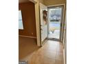 Inviting foyer with tile flooring and a view of the front yard, creating a warm welcome at 709 Kilkenny Cir, Lithonia, GA 30058