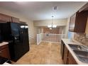Kitchen has stainless appliances and tile floor at 709 Kilkenny Cir, Lithonia, GA 30058