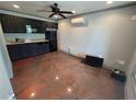 An efficient kitchenette with black cabinets, granite countertops, and stainless steel appliances at 300 Outlaw Rdg, Canton, GA 30115