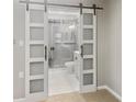 This spacious bathroom features modern sliding doors and a glass shower at 475 Mount Vernon Ne Hwy # 226C, Atlanta, GA 30328