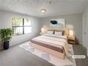 Inviting bedroom with a large window, creating a serene atmosphere for restful nights and comfortable mornings at 7302 Par Four Way, Lithonia, GA 30038