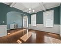 Elegant living room showcasing hardwood floors, large windows, and a coffered ceiling at 1610 Apollo Dr, Suwanee, GA 30024