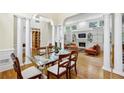 Open-concept living room with fireplace, built-in shelving and abundant natural light at 535 Telford Pl, Atlanta, GA 30342