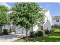 Home featuring a well-manicured lawn and mature landscaping in a peaceful setting at 246 Cavendar Way # 16, Marietta, GA 30066