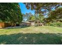 Brick home with lush green lawn and mature trees at 3530 Embry Cir, Atlanta, GA 30341