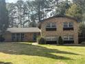 Lovely two-story home with brick facade, a well-manicured lawn, and an inviting front entrance at 3530 Embry Cir, Atlanta, GA 30341