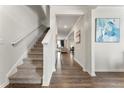 Inviting entryway with hardwood floors and a staircase leading to the upper level of the home at 4823 Layton Dr, Lithia Springs, GA 30122