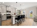 Modern kitchen features stainless steel appliances, granite countertops, and a breakfast bar at 1234 Ravencliff Dr # 157, Austell, GA 30168