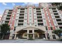 Striking brick and stone building with multiple balconies, offering urban living at its finest at 250 Park Avenue West Nw # 313, Atlanta, GA 30313