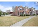 Well-maintained brick townhome features a large yard and convenient sidewalk access at 1754 Heights Nw Cir # 11, Kennesaw, GA 30152