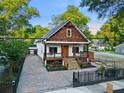 Beautiful home with a front porch, long driveway, and fenced yard at 1060 Mcdaniel Sw St, Atlanta, GA 30310