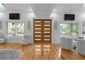 Bright living room with double doors, hardwood floors, and ample seating at 1060 Mcdaniel Sw St, Atlanta, GA 30310