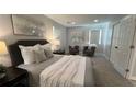 Cozy main bedroom showcasing neutral tones, plush carpeting, and recessed lighting at 2747 Santa Barbara Nw Dr, Atlanta, GA 30318