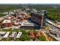 High angle view of a building near a hospital showcasing nearby medical facilities, local neighborhood and mature surrounding trees at 8 Collier Nw Rd # B2, Atlanta, GA 30309