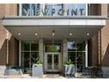 Elegant building entrance with modern design, planters, and clear signage for ViewPoint at 855 Peachtree Ne St # 1912, Atlanta, GA 30308