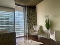 Inviting living room with contemporary decor and a view of the balcony at 855 Peachtree Ne St # 1912, Atlanta, GA 30308
