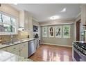 Bright kitchen with granite countertops, stainless steel appliances, and a view of the backyard through the windows at 3916 S Martin Way, Lithia Springs, GA 30122