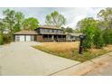 Charming two-story home with a covered porch, and a spacious front yard at 5254 Greenpoint Dr, Stone Mountain, GA 30088