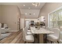 Open floor plan dining area with kitchen view featuring modern white chairs and marble table at 328 Allatoona Shores Dr, Canton, GA 30114
