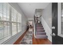 Inviting foyer with hardwood floors, staircase, and abundant natural light at 1680 Fair Oak Way # 24, Mableton, GA 30126