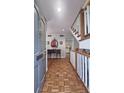 Elegant foyer showcasing hardwood floors, staircase, and decorative accents at 80 La Rue Nw Pl, Atlanta, GA 30327