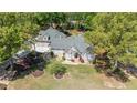 Aerial shot of a home with lush green trees in a beautiful landscaped yard at 4340 Hadaway Nw Rd, Kennesaw, GA 30152