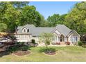 Beautiful home featuring an arched entry, bay window and manicured front lawn at 4340 Hadaway Nw Rd, Kennesaw, GA 30152