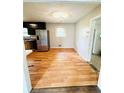 Eat-in kitchen with stainless steel refrigerator and a classic chandelier at 1145 Crestview Ne Cir, Conyers, GA 30012