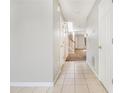 Inviting hallway with tile flooring leads to carpeted living spaces with stairs to the second level at 3651 Sapphire Ct, Decatur, GA 30034