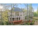 Spacious two-story home featuring a private deck, patio, and lush backyard at 4002 Moheb Sw St, Atlanta, GA 30331