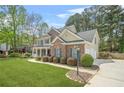 Well-maintained two-story home featuring a two car garage and landscaped front yard at 4522 Willow Oak Trl, Powder Springs, GA 30127