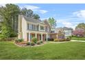 Spacious two-story home with brick and siding, complemented by a lush green lawn at 4522 Willow Oak Trl, Powder Springs, GA 30127