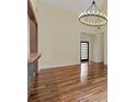 Bright living room with hardwood floors, high ceilings, and modern lighting at 475 Brown Thrasher Ct, Alpharetta, GA 30009