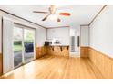 Bright living room with hardwood floors and a sliding glass door to the backyard at 2442 Wentworth Ne Dr, Atlanta, GA 30345